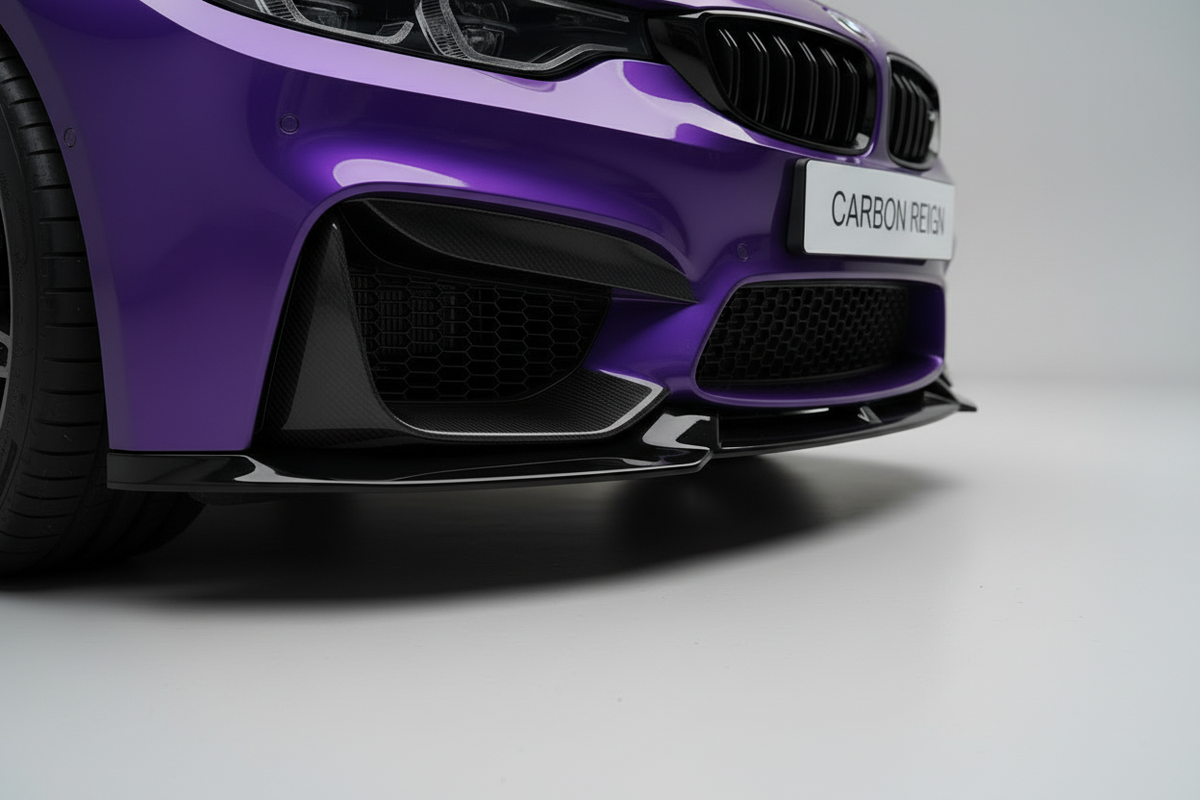Close-up of the front bumper and lower grille area of a purple car, showing black carbon-fiber front splitter and mesh air intakes, with a badge reading 'CARBON REICH'.