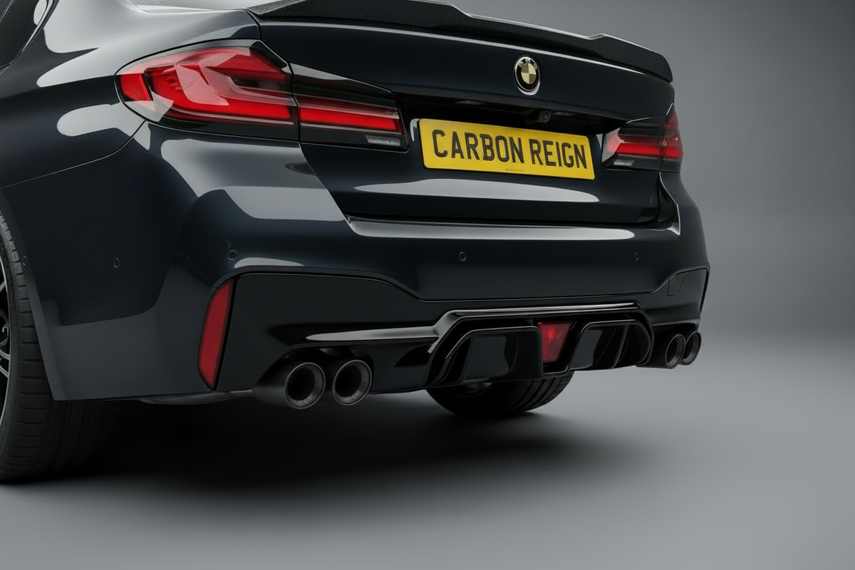 Rear three-quarter view of a dark metallic BMW M2 with a carbon fiber rear diffuser and a yellow license plate reading 'CARBON REIGN'.