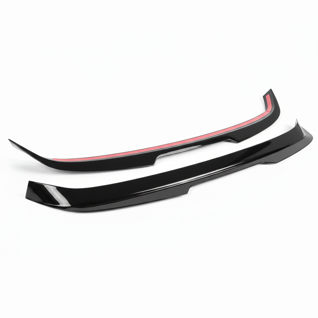 A pair of glossy black car body trim pieces, likely a front splitter and rear lip spoiler, displayed against a plain white background.
