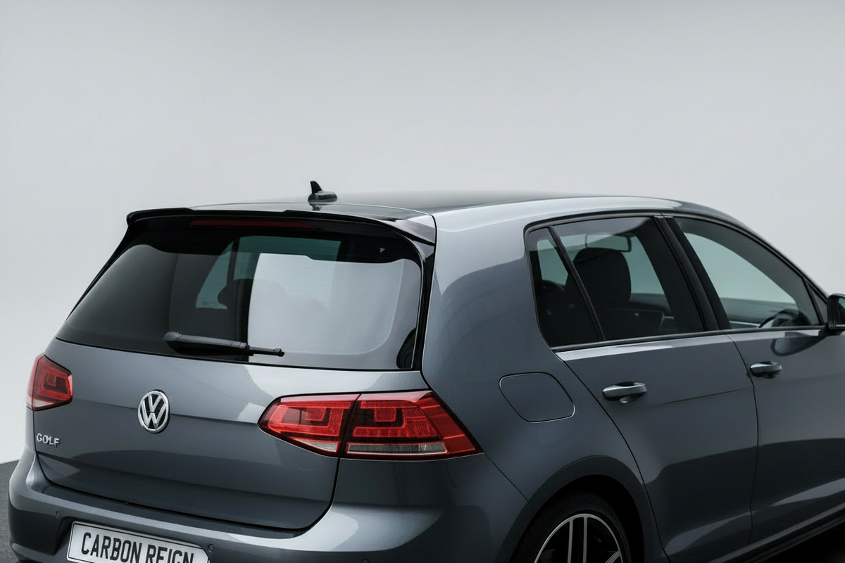 A gray Volkswagen Golf R hatchback car shown from a rear three-quarter angle against a plain light gray studio background.